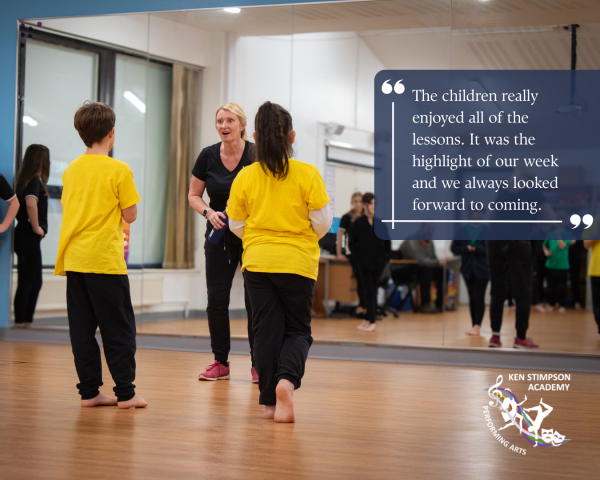 Photo of two students facing a dance teacher