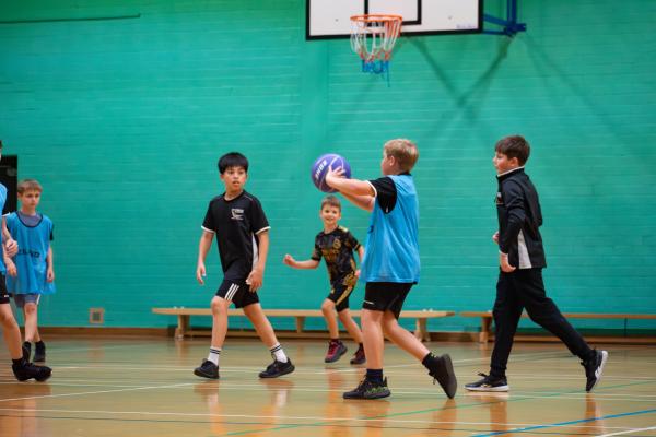 Photo of students playing basketball