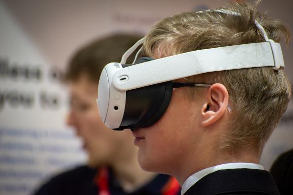 Photo of a student wearing a virtual headset